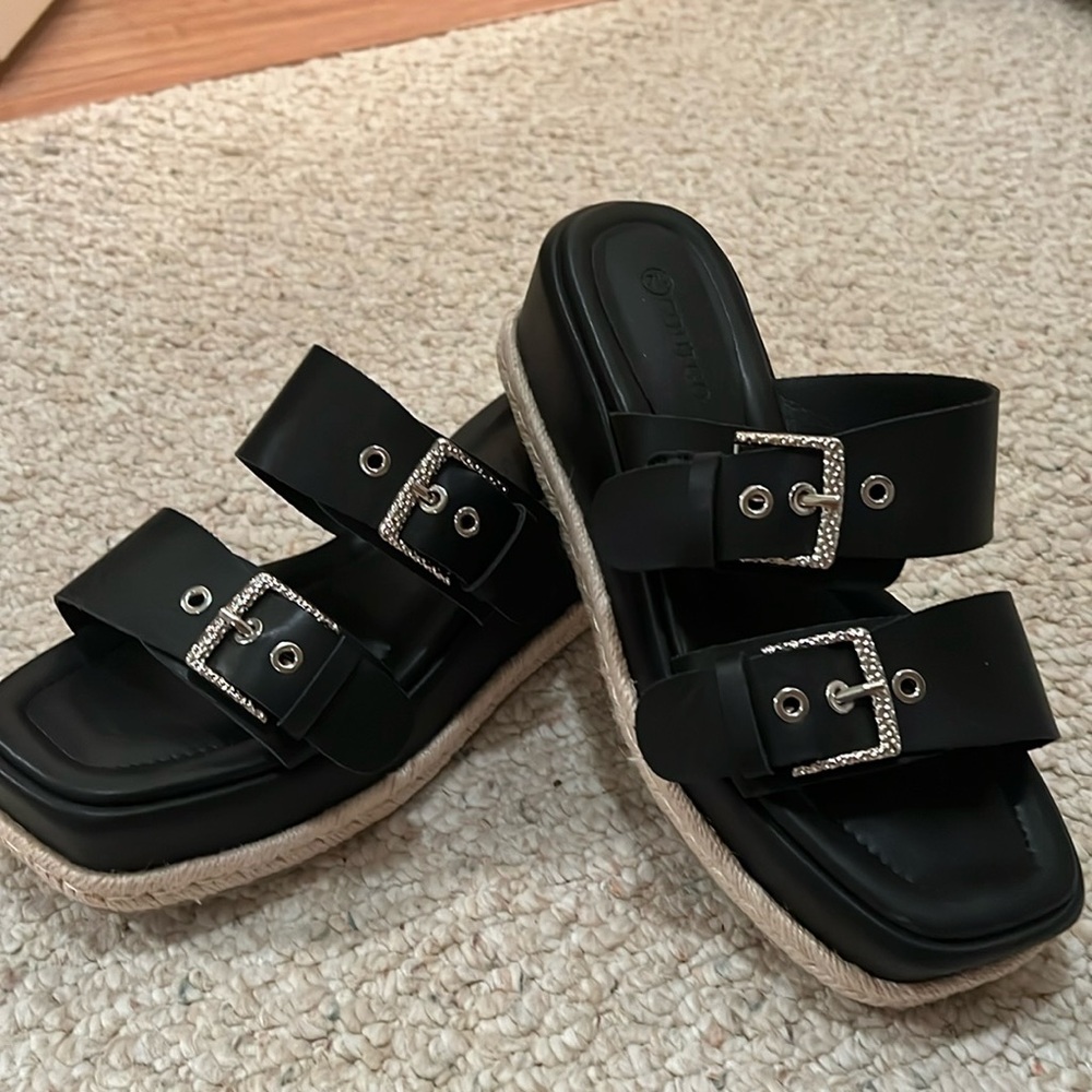 Black buckled wedges